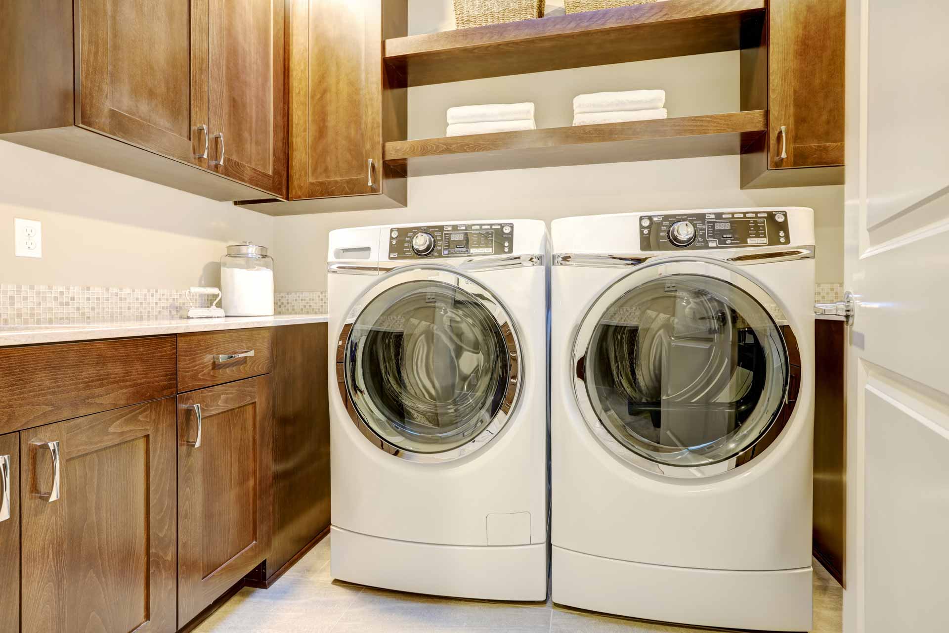 a washer and dryer in a small room.
