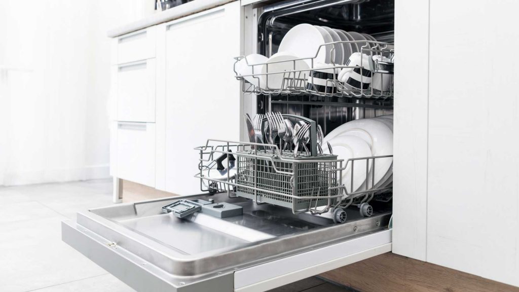 a dishwasher is open in a kitchen.