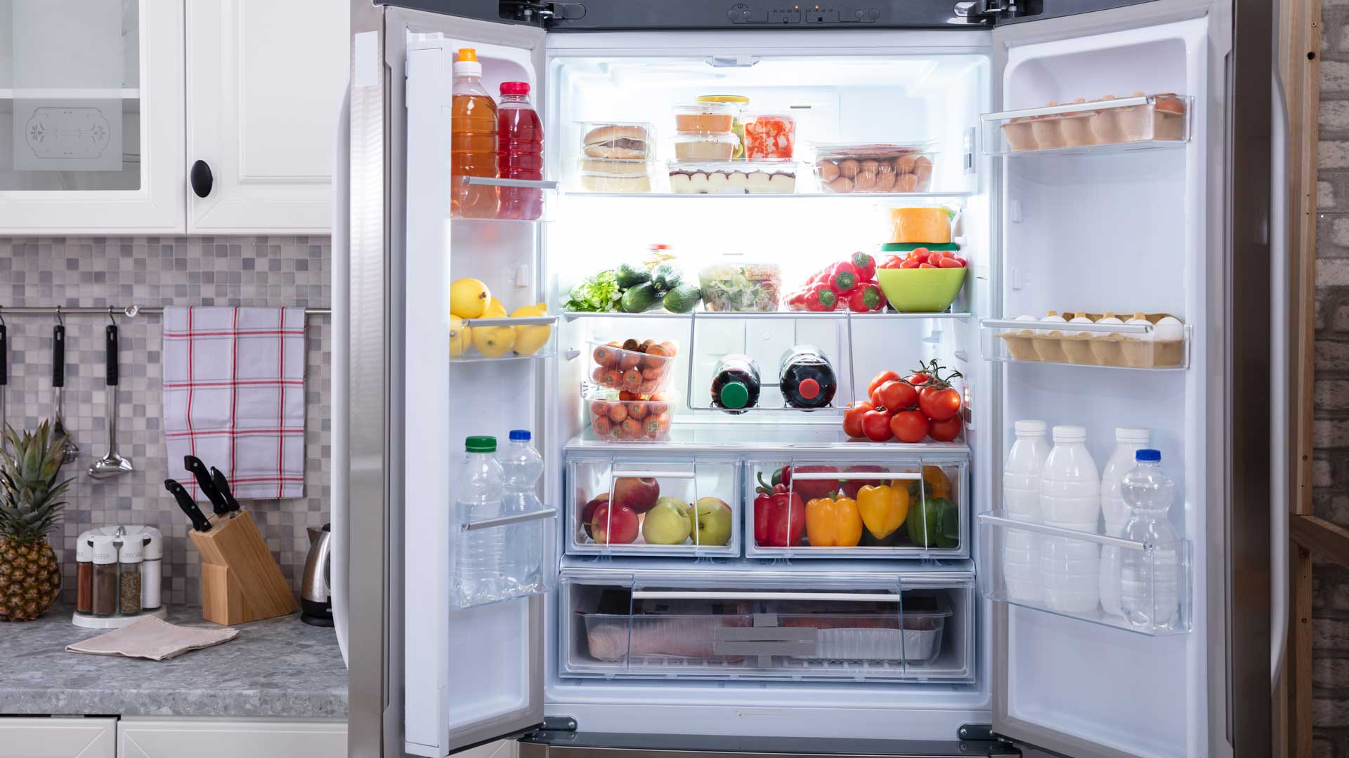 a refrigerator filled with lots of different types of food.