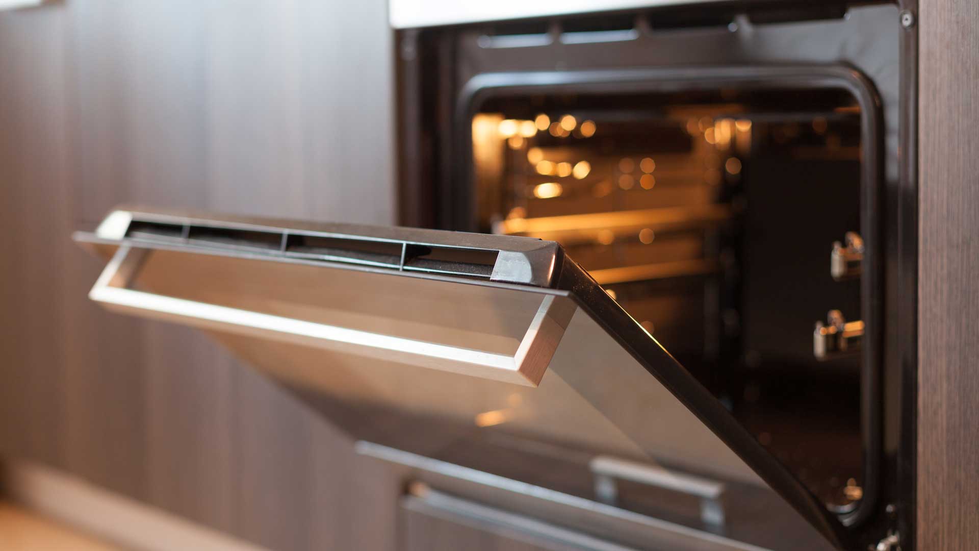 a close up of an oven with a door open.